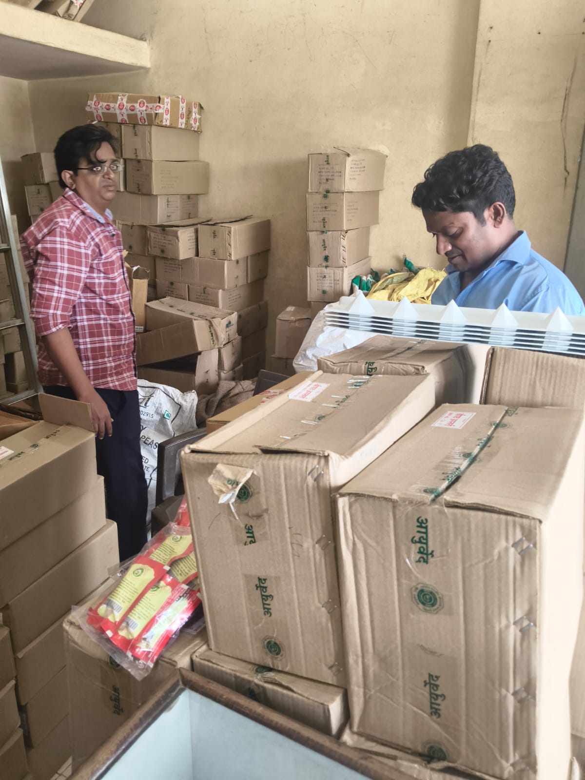 Ayurvedic product stock being checked at the store
