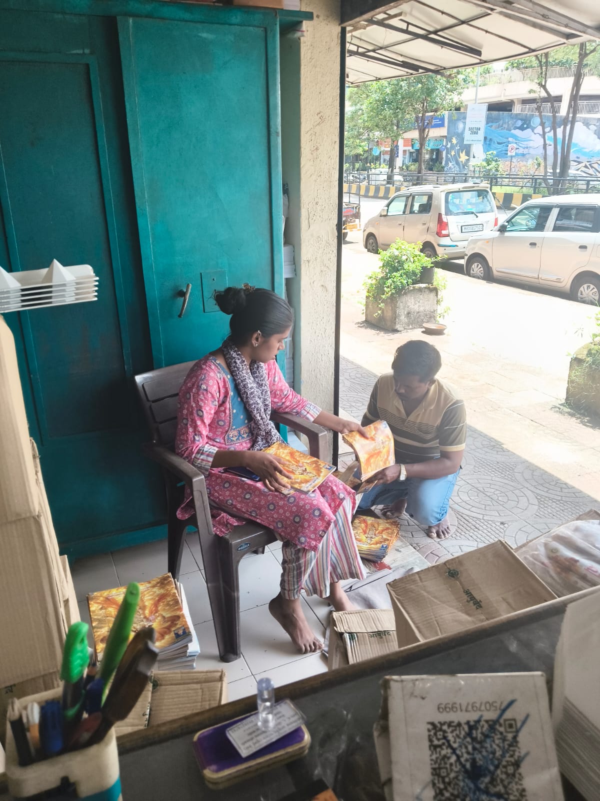 Preparing product packs at the shop front in Airoli